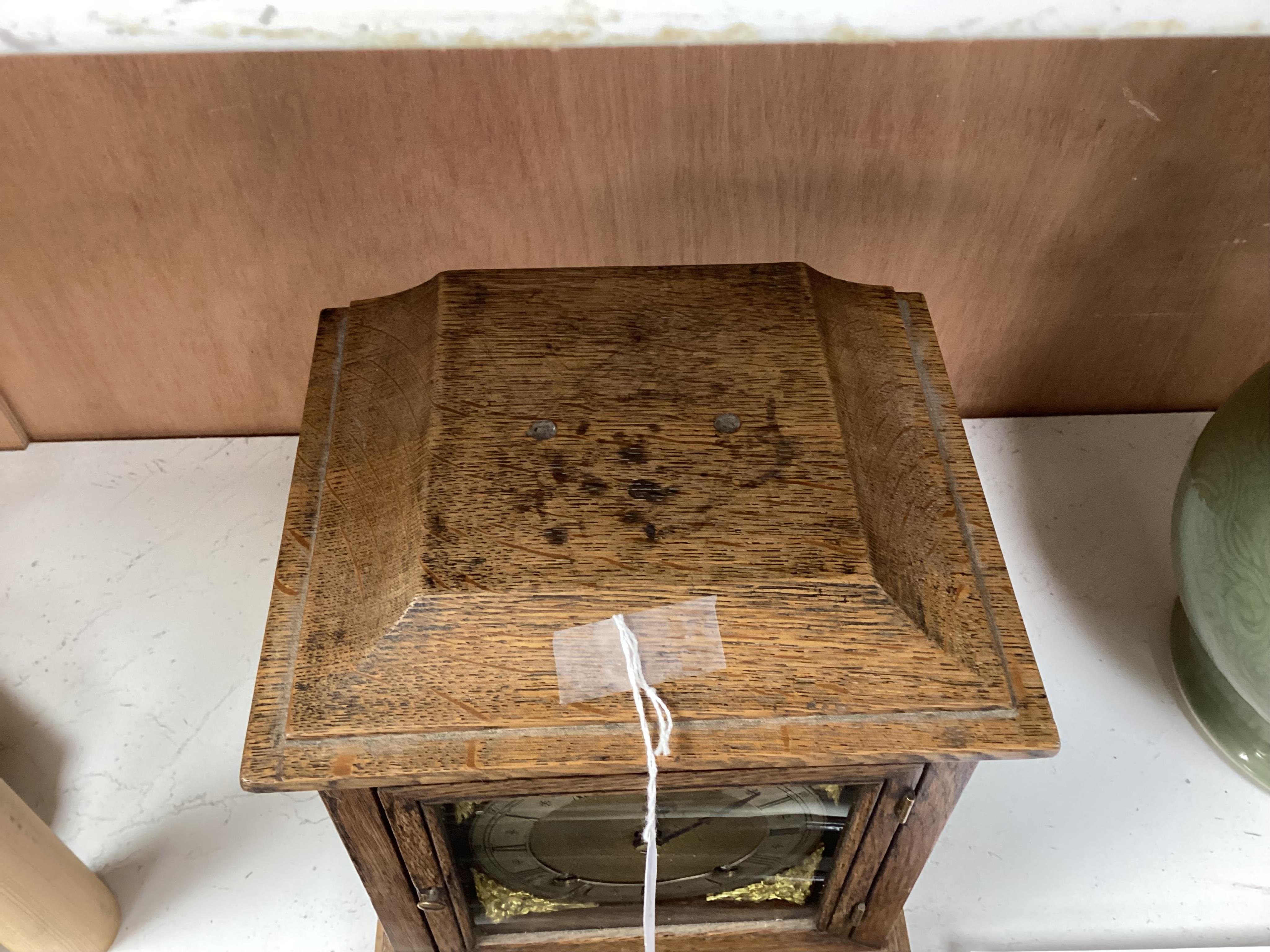 A late 19th century W&H oak cased mantel clock, chiming and striking on two coiled gongs, 27cm high. Condition - fair to good, missing the handle to the top